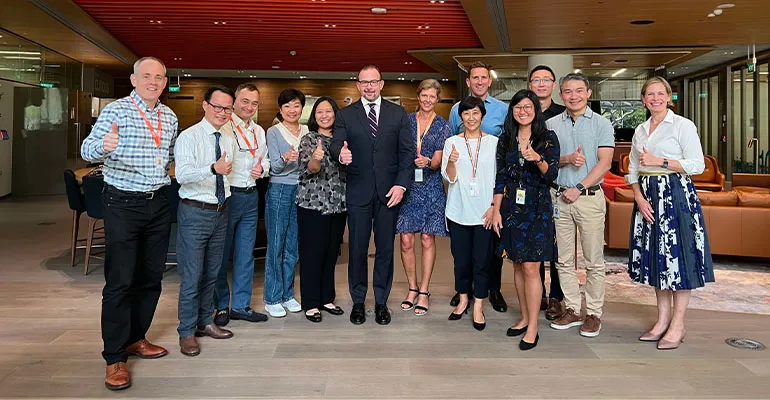 Having had a rich set of experiences in the pharmaceutical sector, GSK’s Mike Crichton (center), joined the diverse global talent community in Singapore, where he is driving impact in his role.