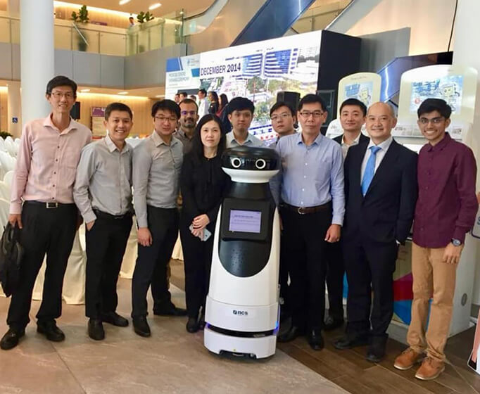 Dr Tan and NCS team presenting home-brewed concierge robot Kompass, at the official opening of Changi General Hospital’s new medical centre