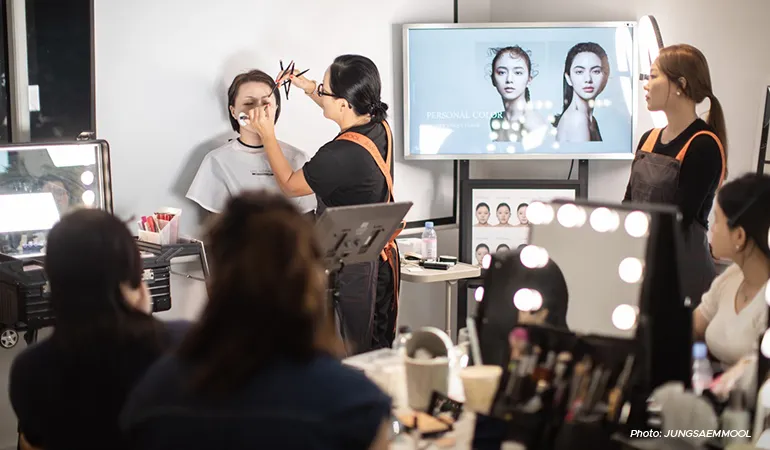 Jung demonstrates her signature K-beauty makeup techniques at a workshop.