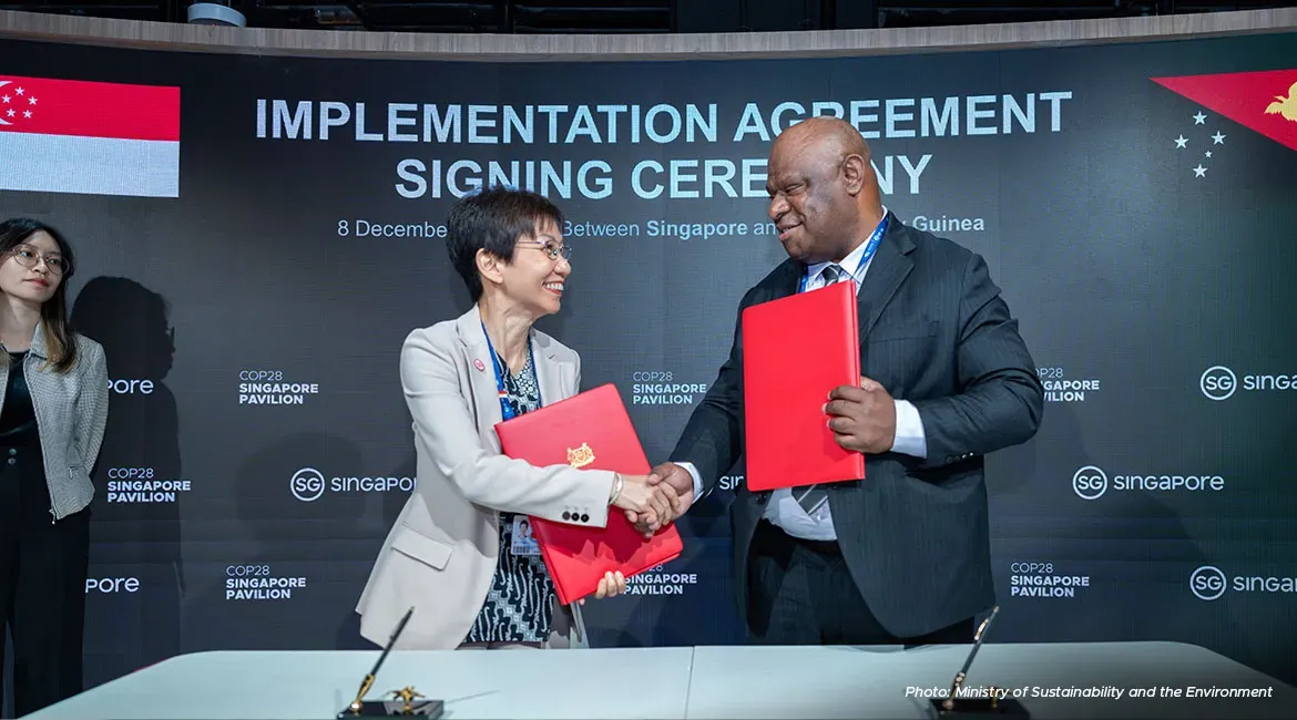 Grace Fu, Minister for Sustainability and the Environment, and Simo Kilepa, Papua New Guinea Minister of Environment, Conservation and Climate Change, at the December 8 signing ceremony of the implementation agreement between Singapore and Papua New Guinea. 