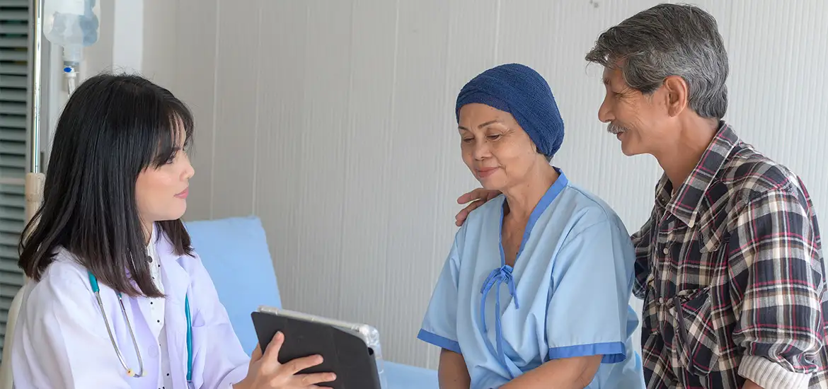 Doctor reviewing a cancer patient’s treatment options