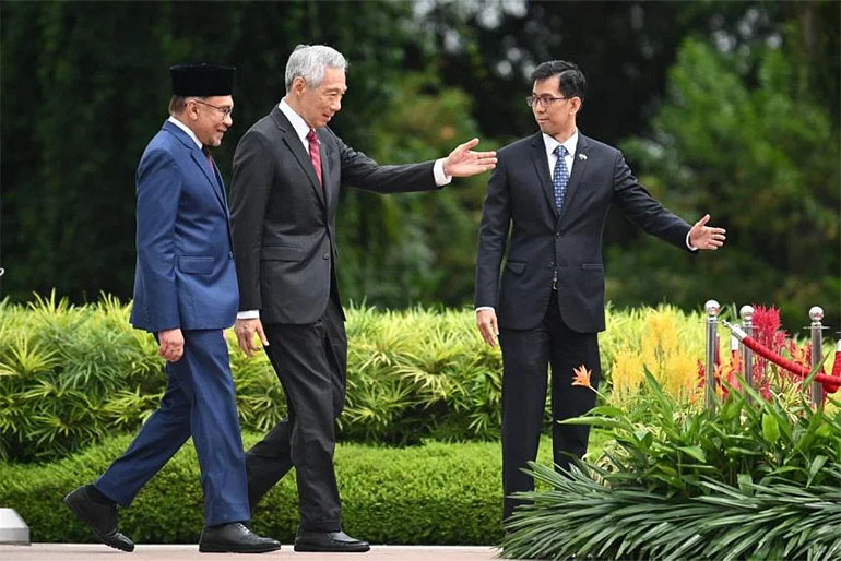 During his one-day visit, PM Anwar and PM Lee will witness the signing of three agreements between Singapore and Malaysia. Image courtesy of SPH Media.