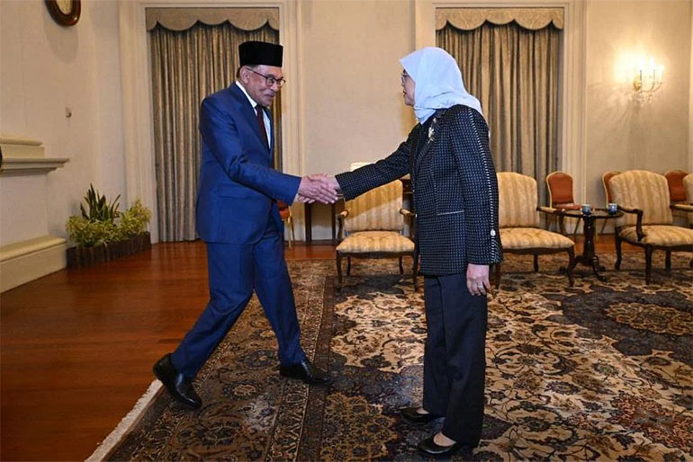 President Halimah Yacob receiving PM Anwar at the Istana on Jan 30, 2023. Image courtesy of SPH Media.