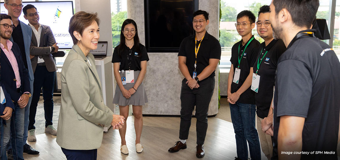 Minister for Communications and Information Josephine Teo (in grey) speaking to young talents at SAP Labs, on June 14. 