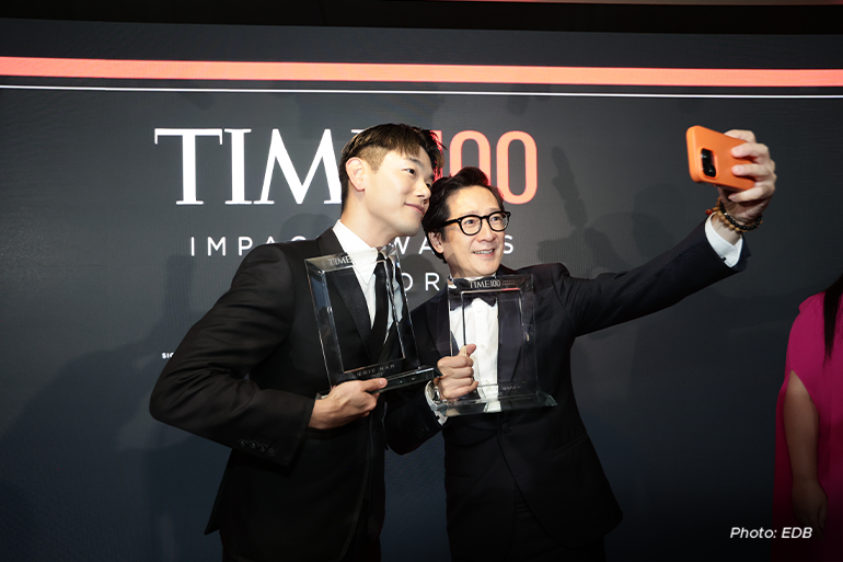 Above: Eric Nam and Ke Huy Quan take a selfie with their TIME100 Impact Awards image