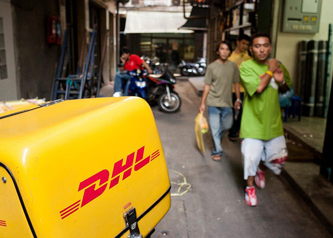 A DHL motorbike in a street of Bangkok, Thailand (Photo: Thierry Tronnel/Corbis via Getty Images).