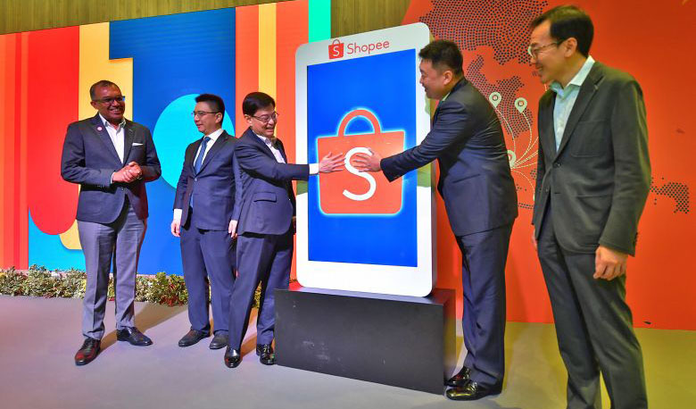 Deputy Prime Minister Heng Swee Keat (centre) and Sea group chief executive and chairman Forrest Li officially opening Shopee’s new regional headquarters yesterday, accompanied by (from far left) Digital Industry Singapore chief digital industry officer Kiren Kumar, Sea chief operating officer and co-founder Ye Gang and Economic Development Board chairman Beh Swan Gin. ST PHOTO: NG SOR LUAN